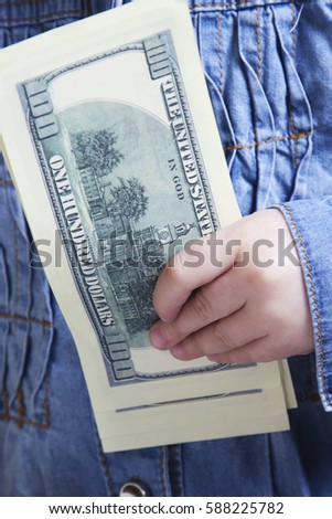 Close up of baby girl with dollars. Success, wealth management. (Humorous picture)