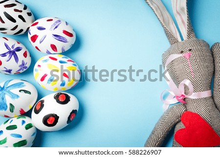 Easter bunny on a blue background. Rabbit. Easter ideas. Easter eggs. Space for text. Happy easter.