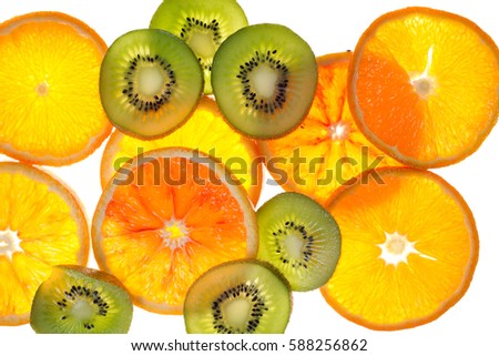 Fresh cut into circles oranges and kiwi on white background