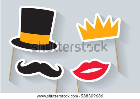 Party set. Concept with cardboard carnival mask. Includes crown, hat, lips and mustache. Masks for a photo shoot. Royalty-Free Stock Photo #588309686