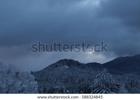 gray winter snow covered mountain range lake