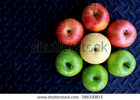 Concept: difference, diet fruit, fruit-shape, colorful of fruit, organic fruit (green apple, red apple and white pear)