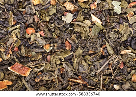 tea leaves Scatter green tea with fruit, traditional Chinese drink