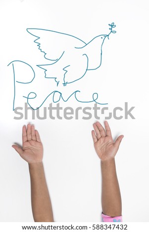 peace concept - Childs hands and painted pigeon
