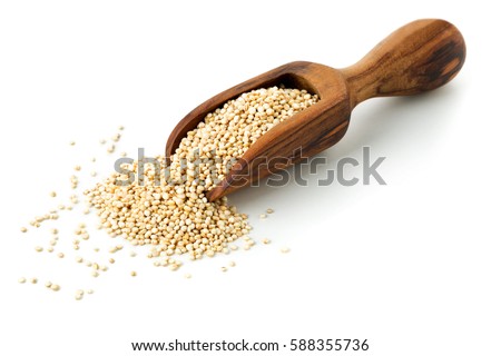 Raw, whole, unprocessed quinoa seed in wooden scoop over white background Royalty-Free Stock Photo #588355736