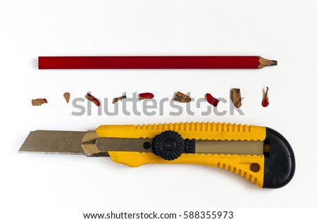 Pencil with cutter knife with shavings, on blank white sheet of paper, on flakeboard