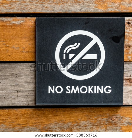 No smoking sign on wood wall