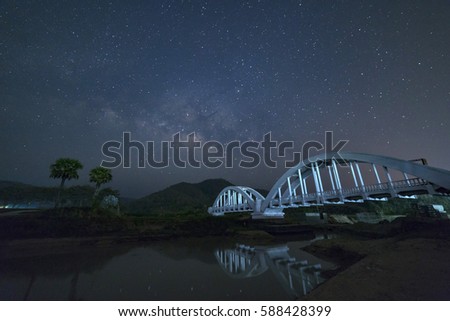 Milky Way and Starry night sky on the white Bridge landscape :  Lamphun, Thailand