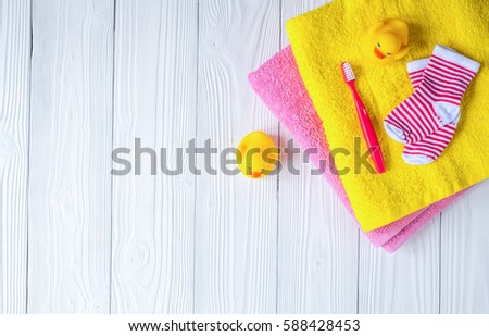 baby accessories for bath on wooden background