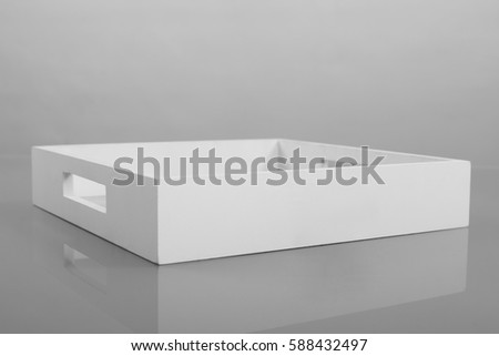 Empty white wooden tray on gray background