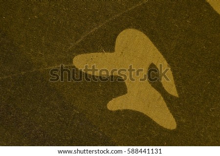 Textile khaki camouflage cloth texture. Closeup of military uniform surface. Background of green camo pattern