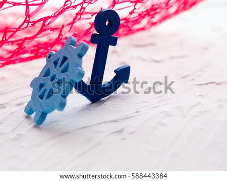 Background with decorative anchors and wheels on a white painted background. Place for text. Top view with copy space.