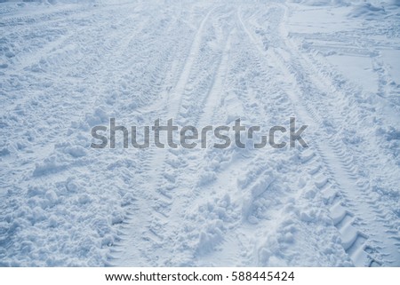 Car wheel track on snow