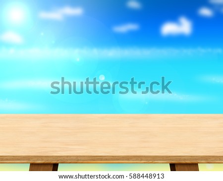 Empty modern wood table top with blur blue sky and sea boekh background,Mock up template for display or montage of product or content