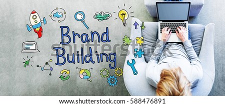 Brand Building text with man using a laptop