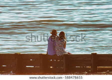 Couple on the beach Royalty-Free Stock Photo #588478655