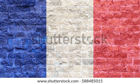 France flag painted on old brick wall