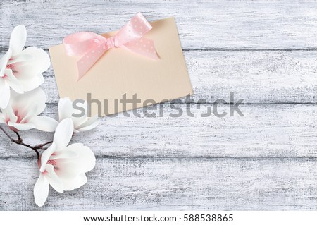 Magnolia flowers on background of shabby wooden planks in rustic style