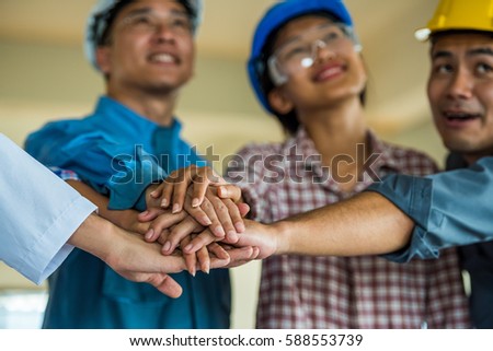 employee group from asian factory make hand shake. manager and worker meeting to good factory performance. the worker is importance for factory.the factory unshaken because employee have good relation Royalty-Free Stock Photo #588553739