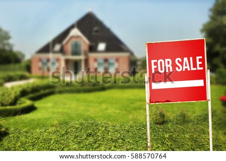 Home For Sale Real Estate Sign in Front of New House.