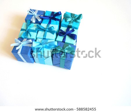  Lots of blue gift boxes. Blue colour. White background                              