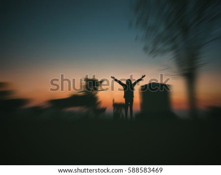 woman open arms under the sunrise ,Image blurry style