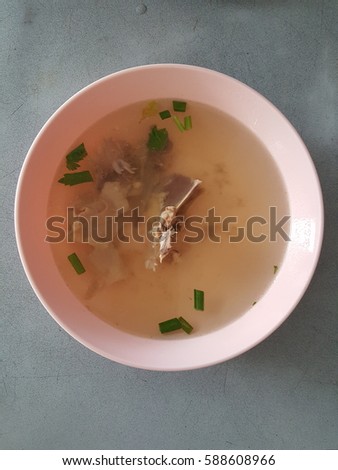 chicken stock soup, isolate serve in a bowl on metal grey background