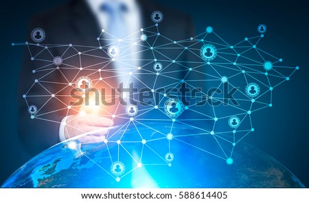 Close up of a hand of a man in suit pointing at a network hologram. There is an Earth globe under it. Toned image. Double exposure. Elements of this image furnished by NASA