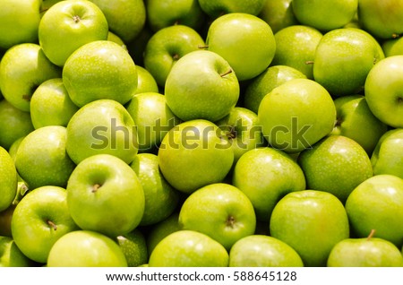 Bunch of green apples in supermarket