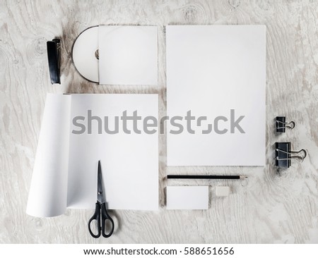 Mock up for branding identity. Photo of blank stationery and corporate identity template on light wooden table background. Responsive design mockup. Blank objects for placing your design. Top view.