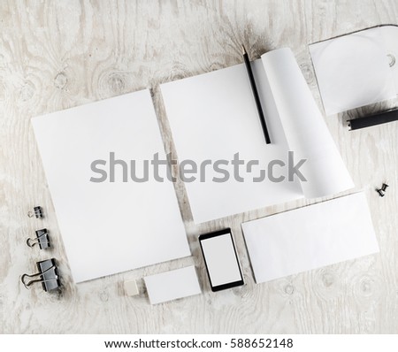 Blank corporate identity template on light wooden table background. Photo of blank stationery, ID mock-up. Mockup for branding identity. Blank objects for placing your design. Responsive design.