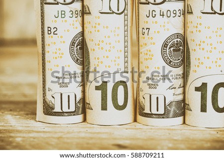  dollar bills tied with rubber band