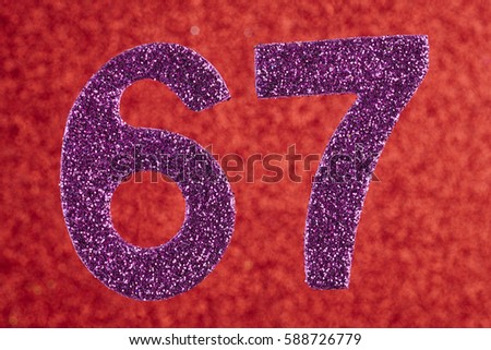 Number sixty-seven purple color over a red background.
