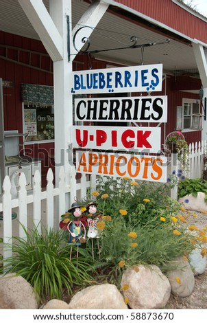 Farmers fruit signs at U-pick farm in Michigan in Summer