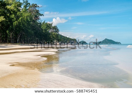 Outdoor landscape of beautiful tropical sea beach with sea water in Khao Sam Roi Yot National Park, Thailand. Beautiful landscape of exotic white sand sea beach and palm trees Southeast Asia, Thailand