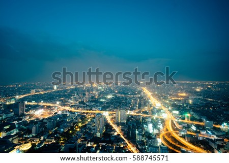 Cityscape photography of Bangkok downtown aerial view at night from the top of BAIYOKE Sky, Thailand landscape. Panorama of Bangkok at dusk with skyscrapers and traffic trails, Thailand, Bangkok night
