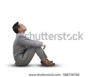 Business man sitting on white background,copy space