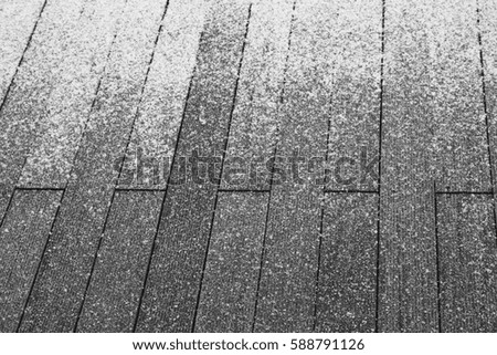 wooden background with snowflakes in black and white