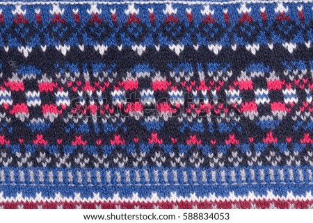 Background of colored wool knit with nordic patterns.