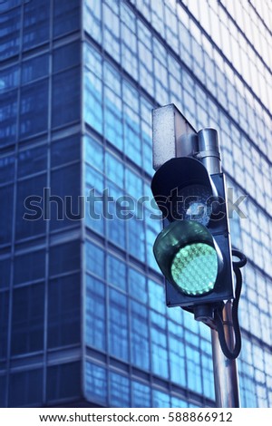 Traffic light with urban background