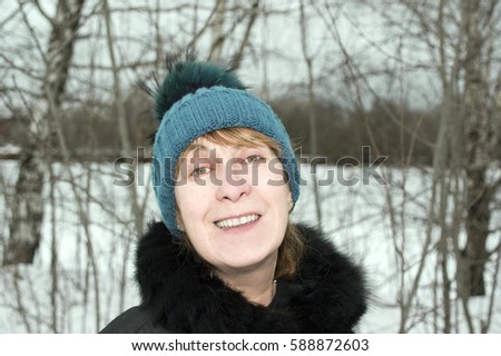 Woman looking positive laughing at camera, outdoor filtered photo