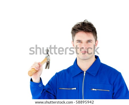 Serious worker holding a hammer looking at the camera against white background