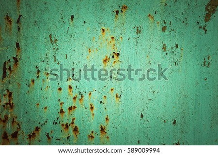 Cracked green, azure paint on metal, rust. For background