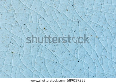 close up background and texture of stretch marks cracked on blue glazed tile Royalty-Free Stock Photo #589039238