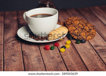 Chocolate cookies, shortbread, crackers, bread coffee mug..