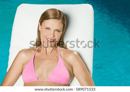 Young woman at poolside