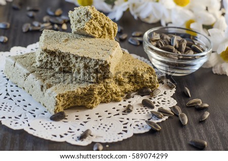 halva and sunflower seeds close-up on a black background