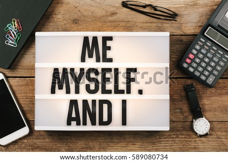 Me, myself and I in vintage style light box on office desktop, high angle birds eye view Royalty-Free Stock Photo #589080734