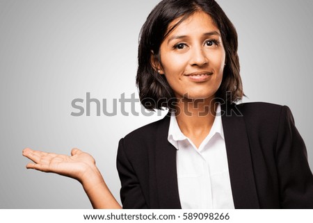 latin business woman holding something