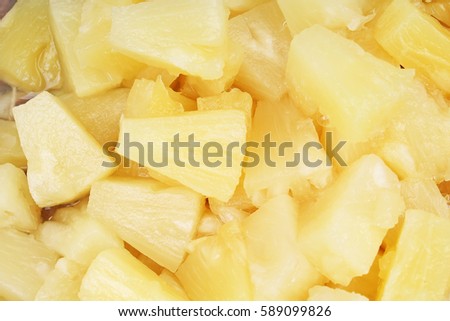 Pineapple slices as background. Yellow pineapples texture pattern.
